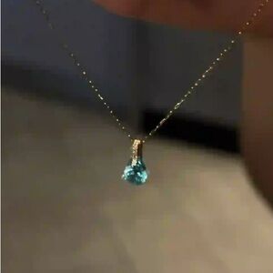 Elegant Gold Necklace with Blue Pendant